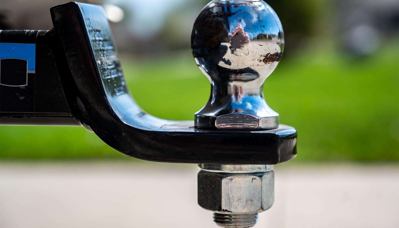 Stock photo: a chrome tow ball on a black tow bar tongue.